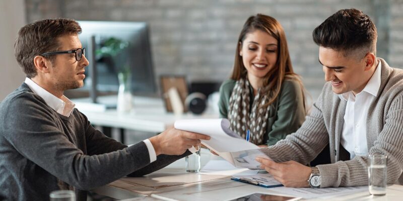 couple working with a loan officer