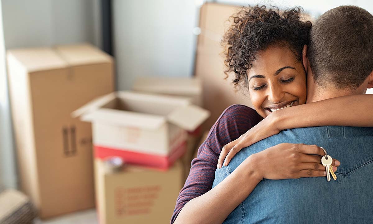 Young couple moving into their home